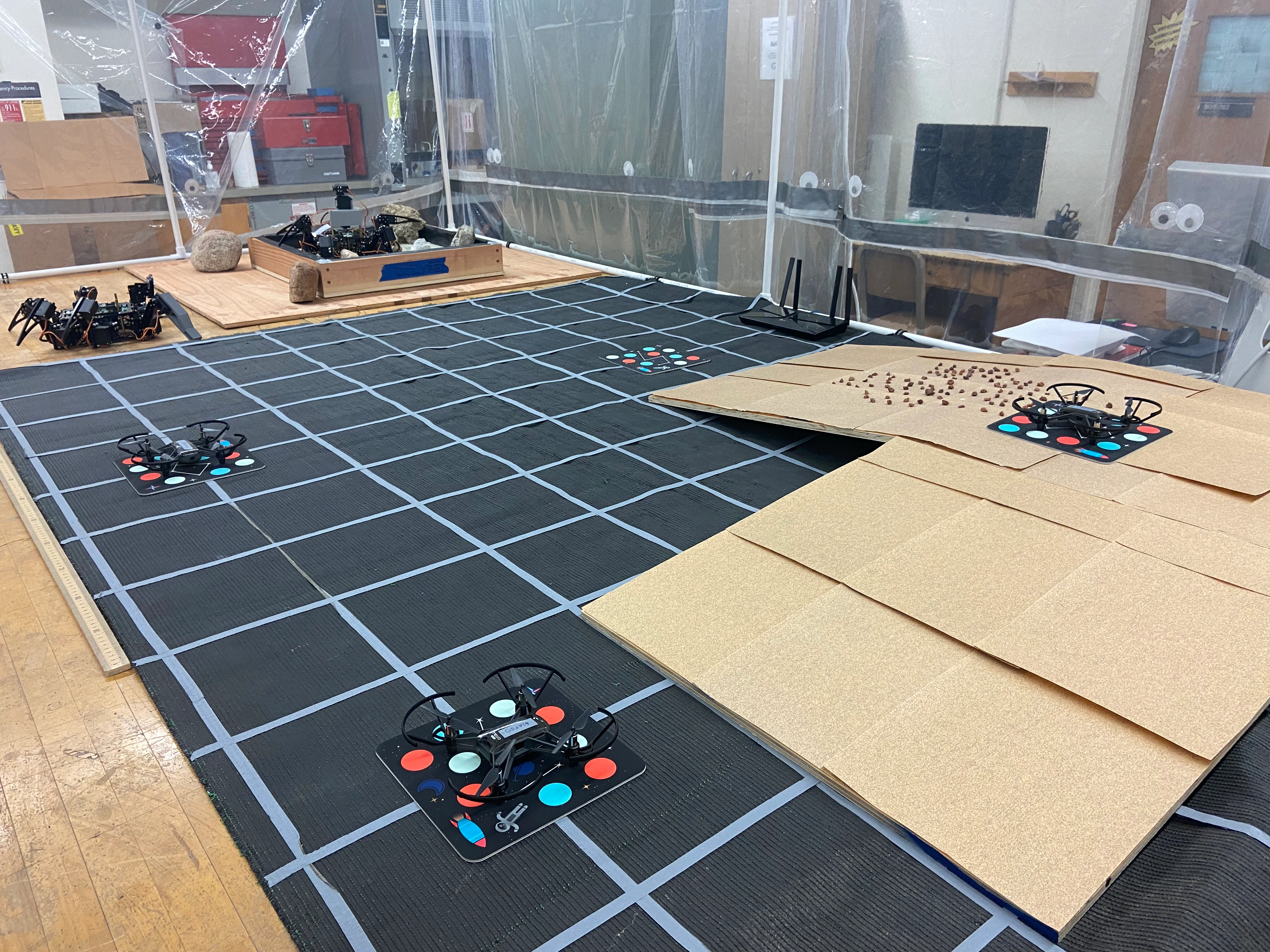 Tello EDU drone swarm preparing to take off from the Lunar Geology Lab Flight Enclosure